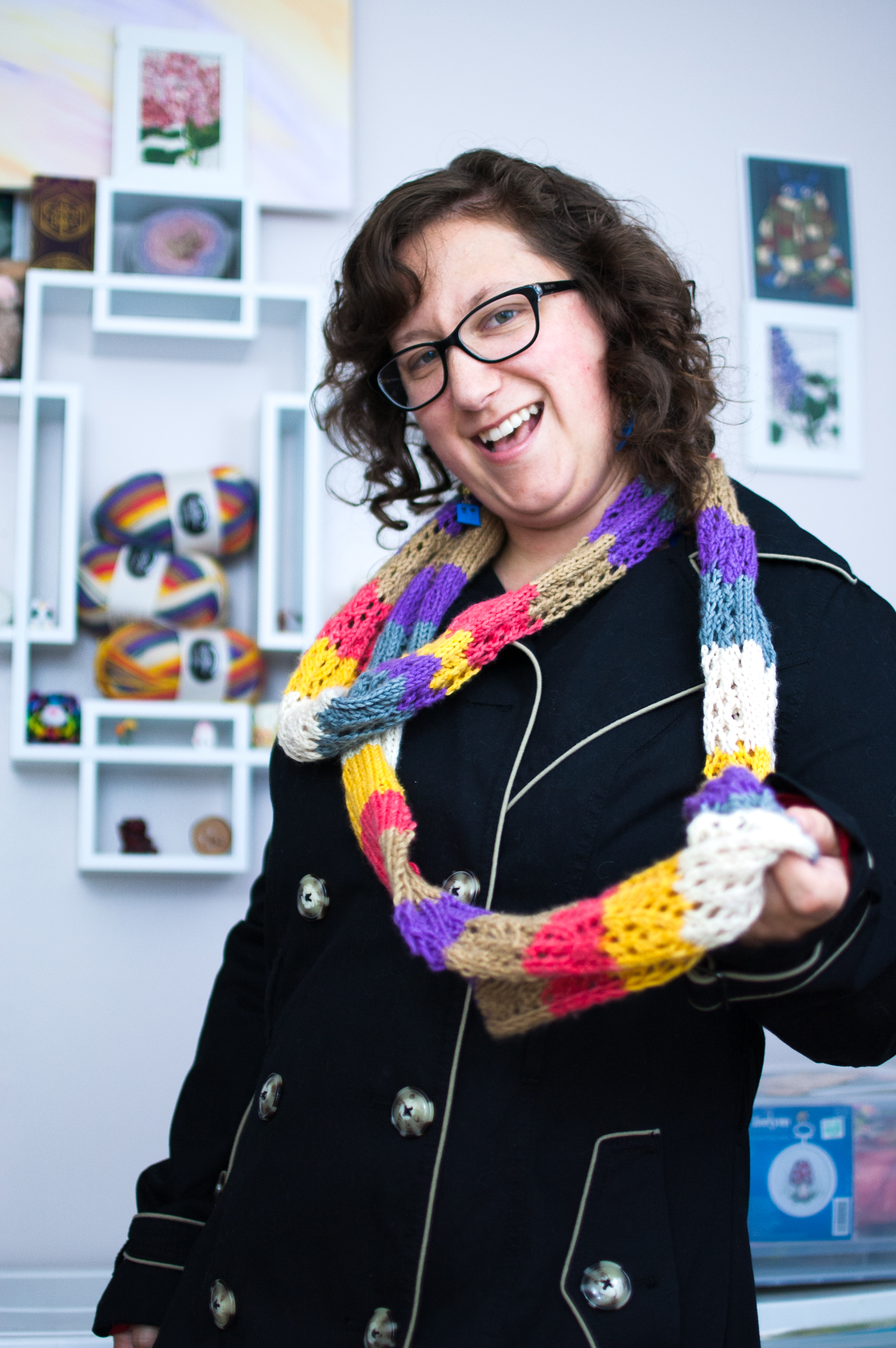 The ultimate knitting geek! A geeky knitter wearing a fancy Doctor Who-inspired knitted scarf