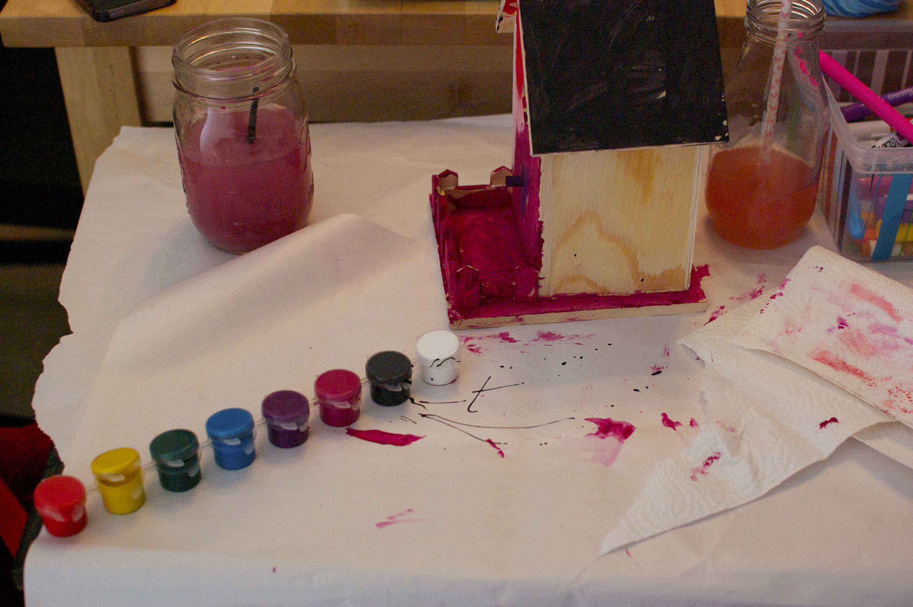 Paints and a birdhouse